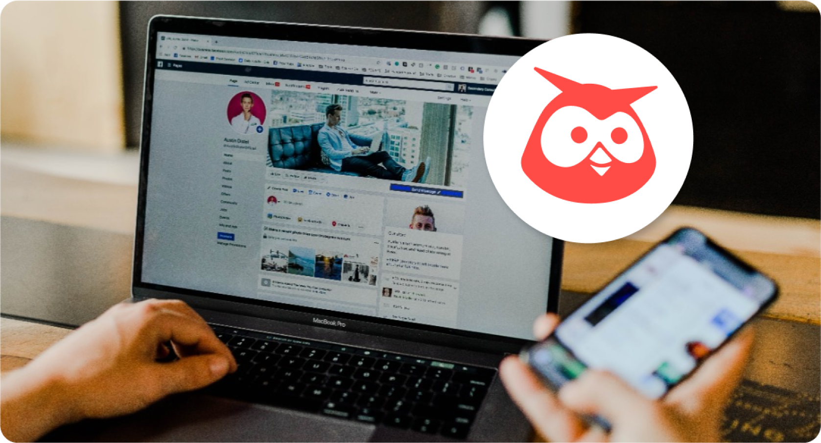 A person is using a laptop with an owl logo on it.